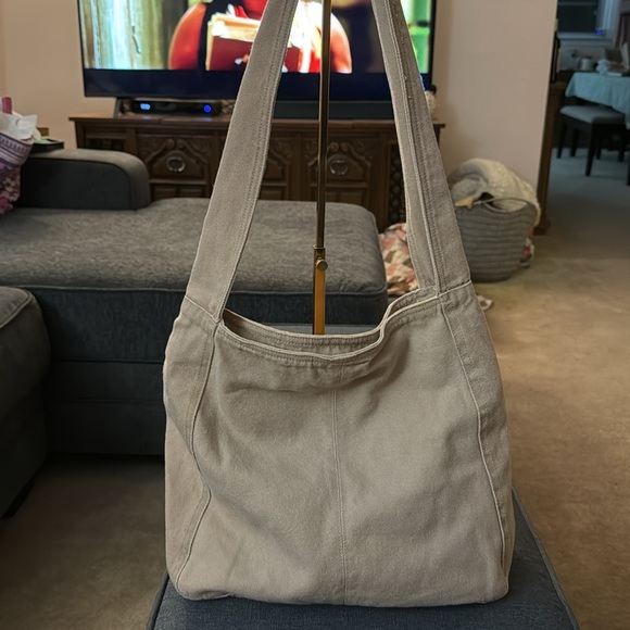 A tan/khaki shoulder bag. - Picture 3 of 5